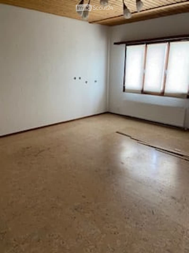 Completely empty room with bare walls and wooden floor. No furniture or equipment.