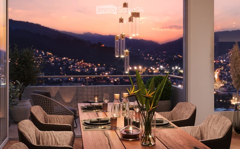 Elegant balcony with a dining setup, overlooking a cityscape at sunset, featuring a wooden table, chairs, candles, wine glasses, and decorative plants.