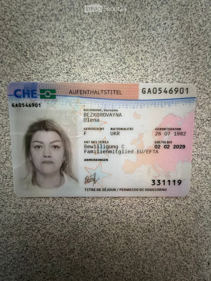 Residence permit card with a photograph of a woman, personal details, and validity information.