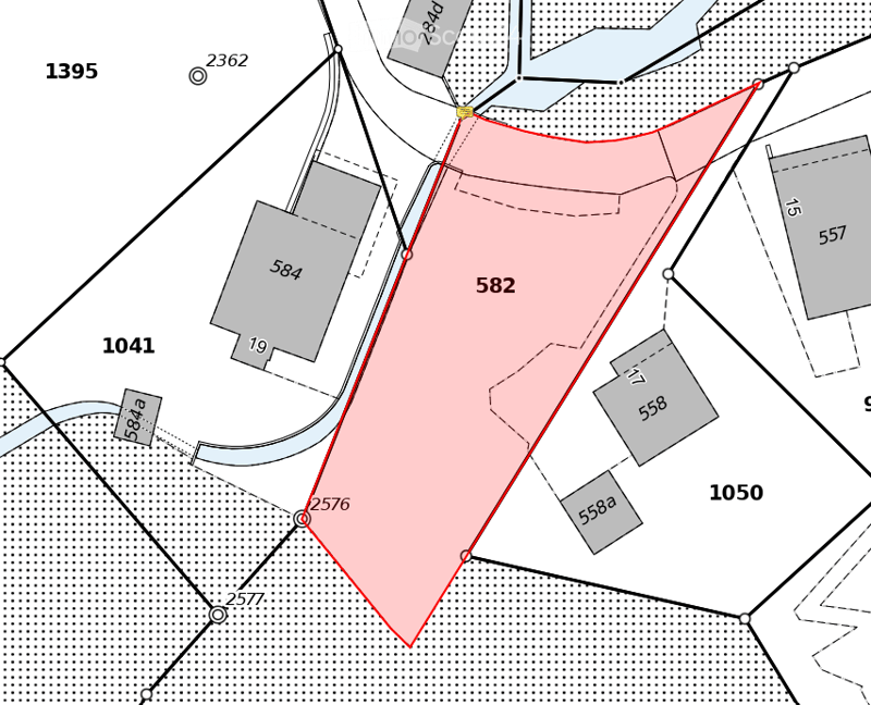 Floor plan showing a residential plot labeled582, surrounded by neighboring plots and roads.