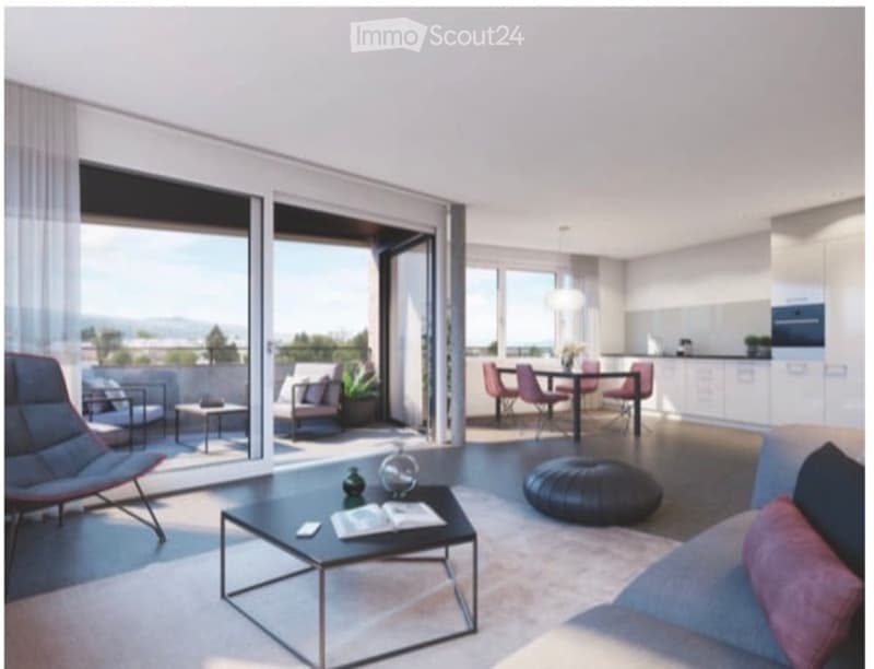 Modern living room with large sliding glass doors leading to a balcony, a sofa, coffee table, chairs, a dining table, and a round ottoman.