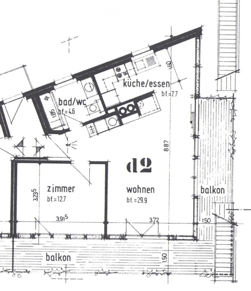 Floor plan showing a kitchen/dining area, bathroom/WC, living room, bedroom, and balcony.