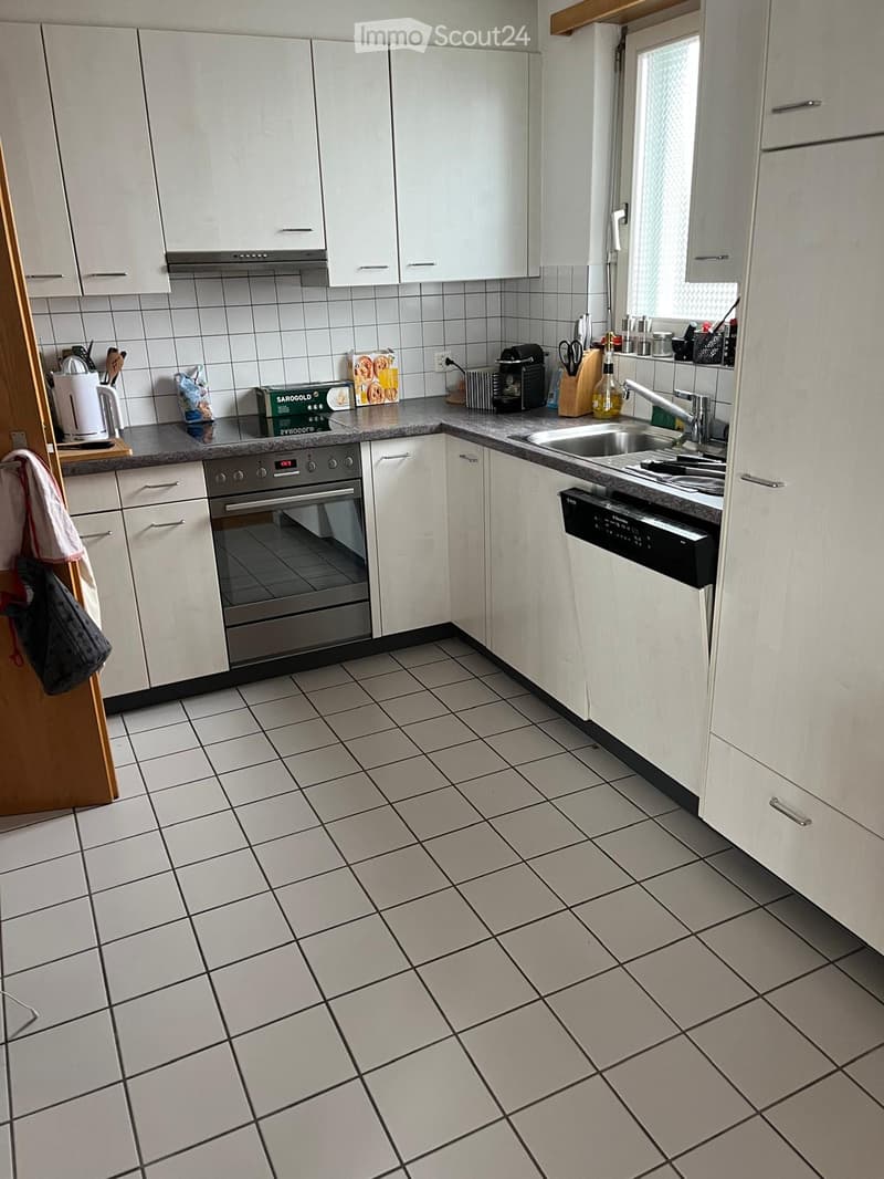 modern kitchen with tiled floor, white cabinets, stainless steel appliances, sink, dishwasher, oven