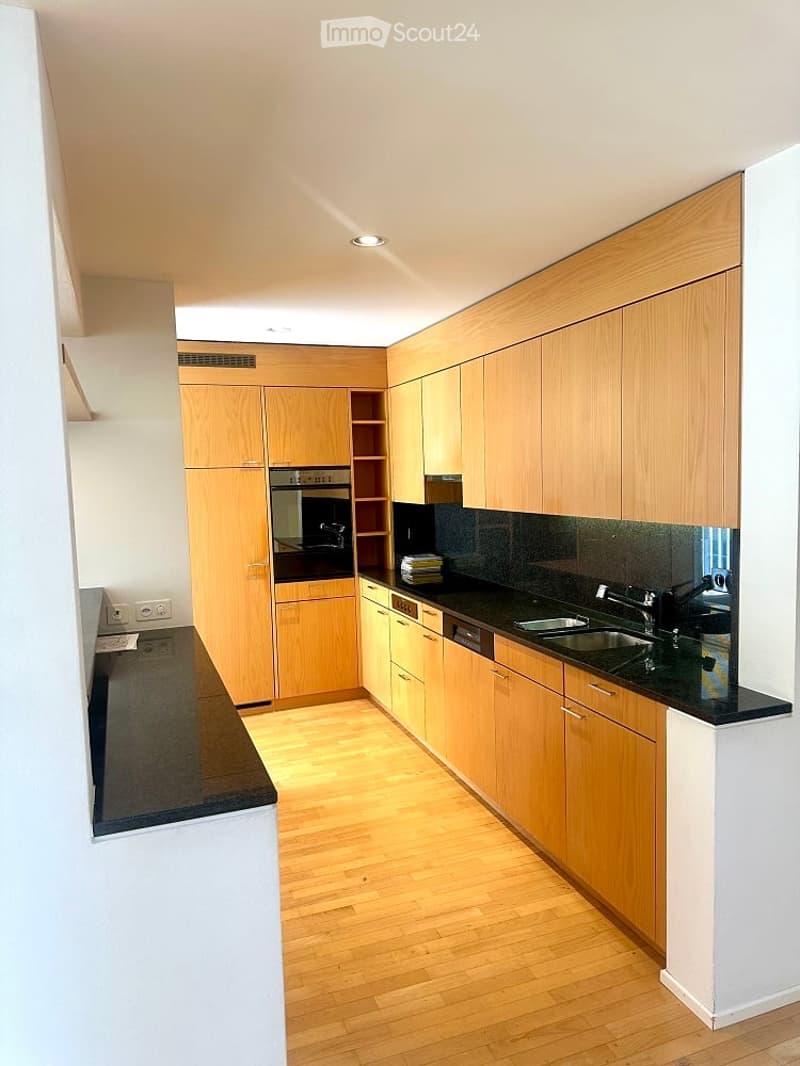 kitchen, wooden cabinets, granite countertop, black oven, dishwasher, sink