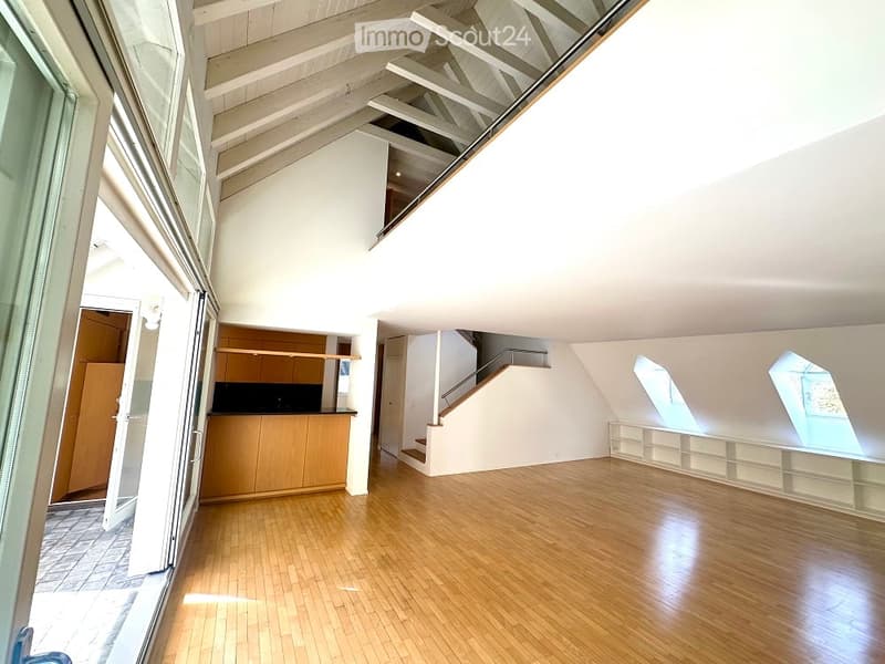 large wooden floor, white ceiling, glass doors, stairs, balcony