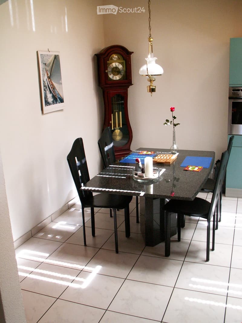Dining area with table, chairs, decorative items, and furniture