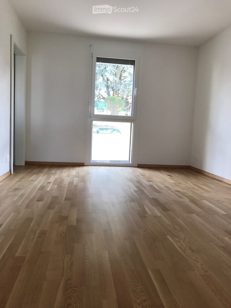 Completely empty room with bare walls and wooden floor. No furniture or equipment.