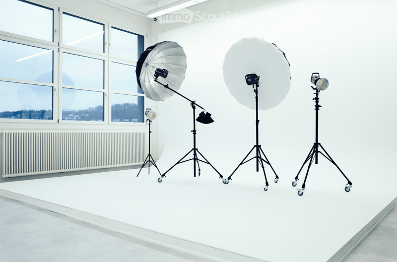 Empty room with large windows, white walls, and a smooth floor. No furniture or equipment present.