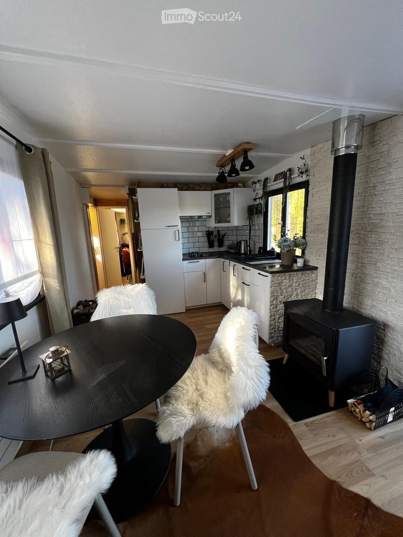 {"type": "Furnished Room", "objects": ["table", "chair", "stool", "stool", "stool", "stool", "stool", "stool", "stool", "stool", "stool", "stool", "stool", "stool", "stool", "stool", "stool", "stool", "stool", "stool", "stool", "stool", "stool", "stool",
