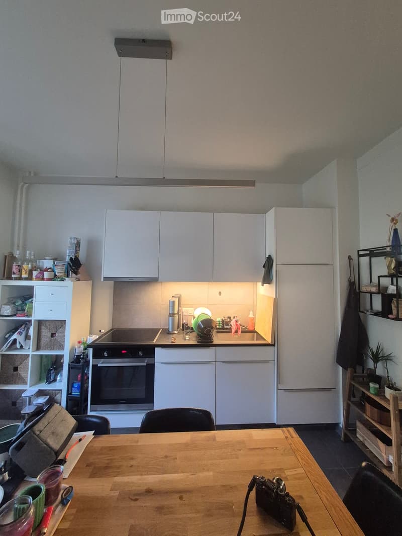 {"type": "Kitchen", "objects": ["table", "chair", "oven", "refrigerator", "sink", "cupboard", "bottle", "camera", "cup", "oven mitt", "oven", "oven", "oven", "oven", "oven", "oven", "oven", "oven", "oven", "oven", "oven", "oven", "oven", "oven", "oven", "