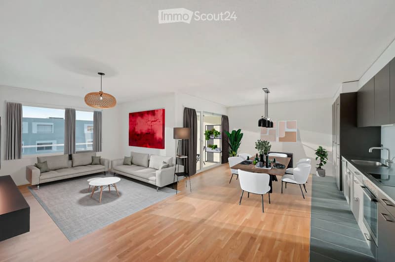 Open living room with large windows, wooden floors, and a gray carpet. A white dining table with chairs is in the corner, a white coffee table in the center, and couches are placed around it. A potted plant is placed on the floor next to the couch.