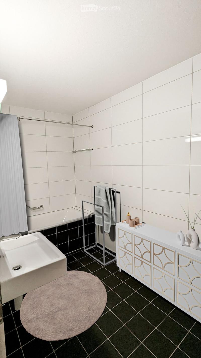 Bathroom with white tiles, modern bathtub, sink, white cabinets, floor heating, white shower curtain, and rug
