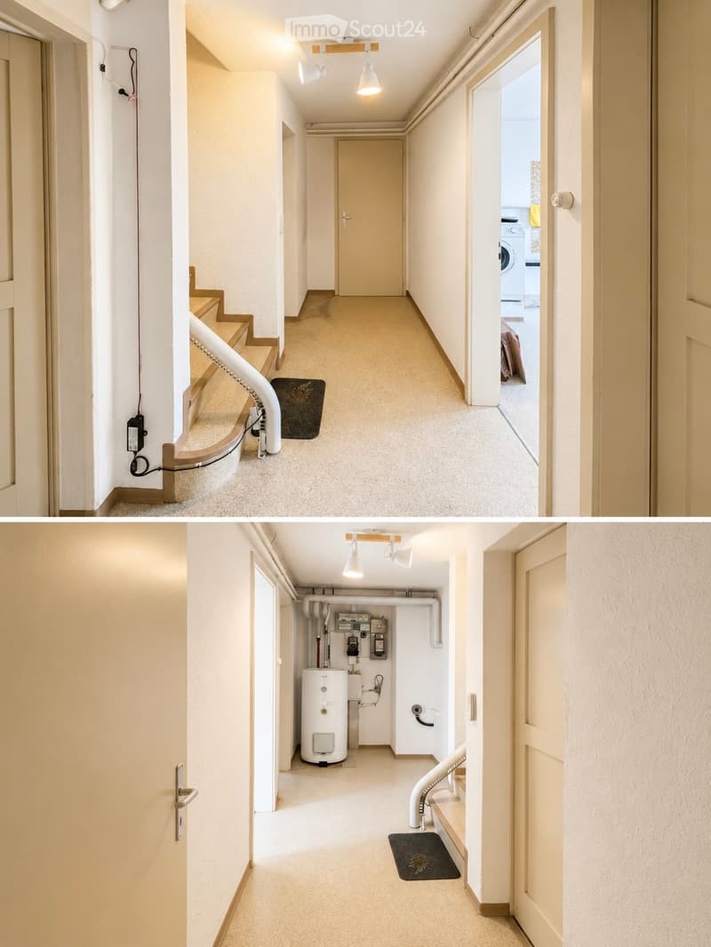 Clean, well-lit hallway with beige walls, carpeted floor, and white ceiling lights. Features a staircase on the left and a door to a room on the right, with visible electrical outlets and a small mat near the staircase.