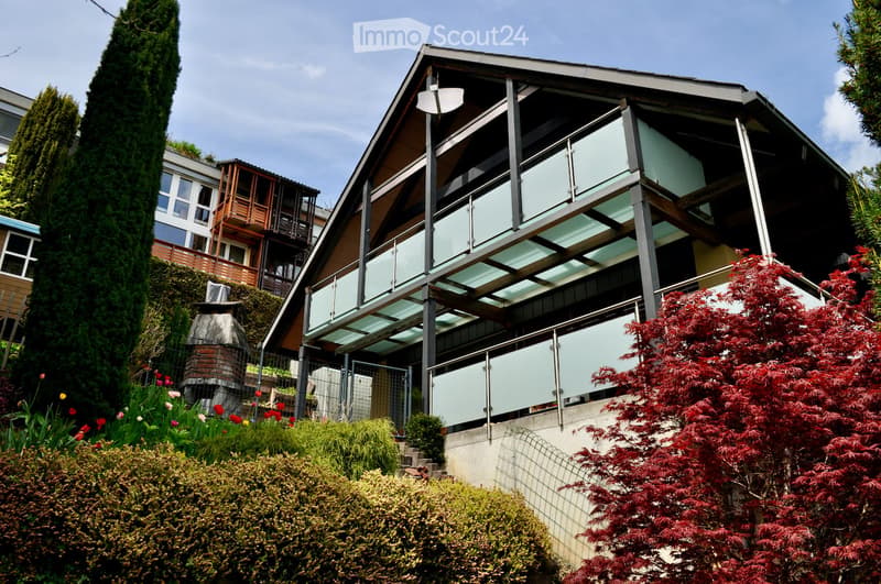 modern house, glass balcony, red brick chimney, garden, trees