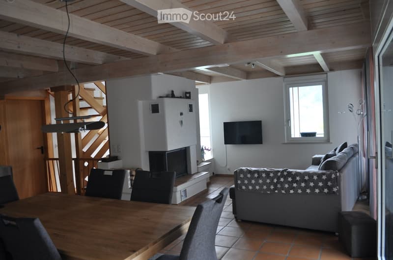 wooden ceiling, fireplace, dining table, chairs, couch, television, window