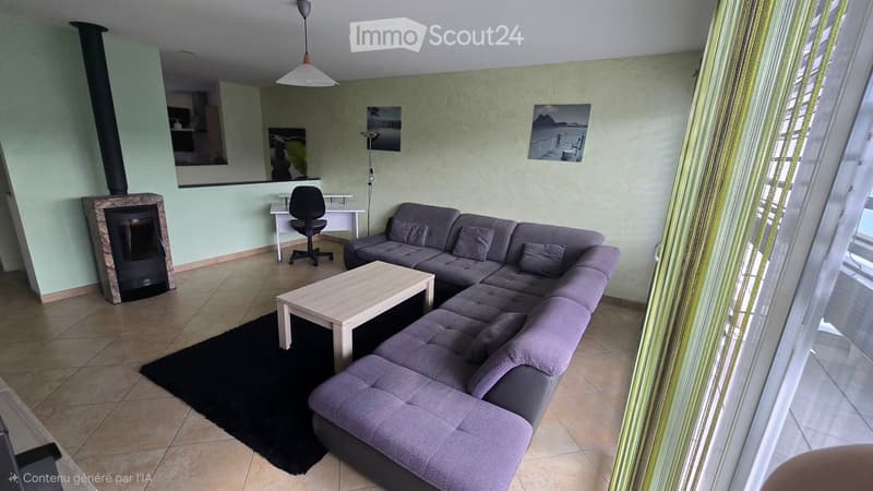 Modern living room with grey sectional sofa, light wooden coffee table, black area rug, fireplace, and hanging lamp.