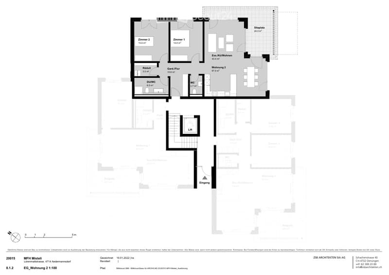 Floor plan of a multi-unit residential building showing two apartments, a shared kitchen/dining area, entrance, lift, and various rooms including bedrooms, bathrooms, and a common area.