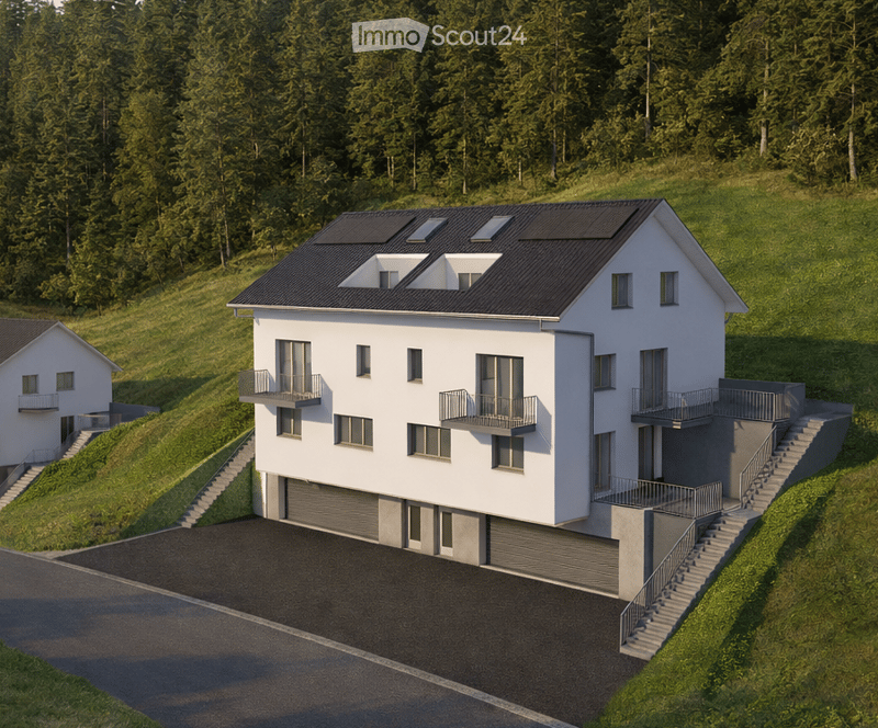 Modern two-story house with white exterior, multiple balconies, garage, and solar panels on the roof, set in a green, hilly landscape.