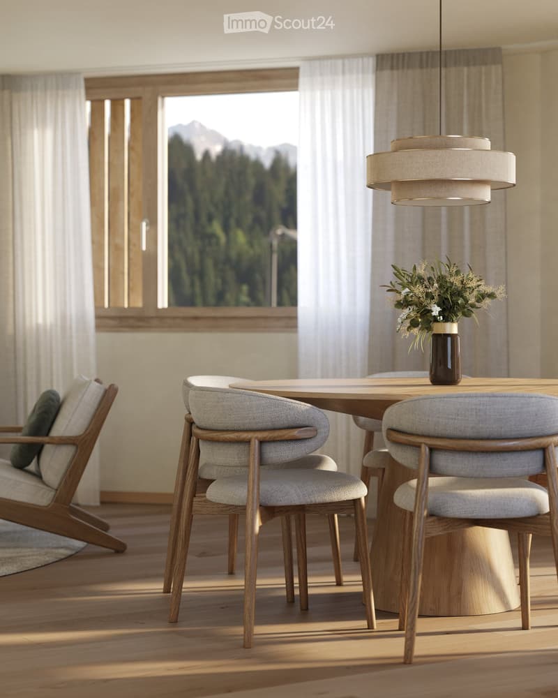 Modern dining area with a wooden table, four chairs, a pendant light, and a sofa with cushions, overlooking a scenic mountain view.