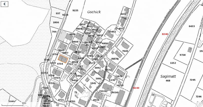 Floor plan showing a residential area with multiple buildings and plots, labeled with numbers and street names.