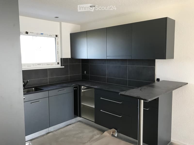 modern kitchen, all black cabinetry, granite countertops, stainless steel sink and faucet, open shelving, large window, tiled backsplash