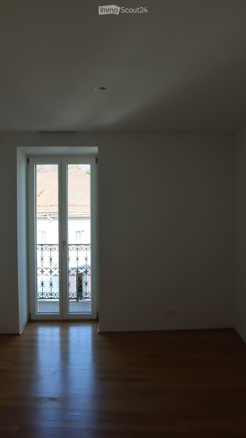 Empty room with a window and a view of the outside