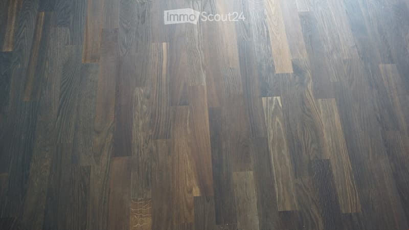 Completely empty room with bare walls and wooden floor. No furniture or equipment.