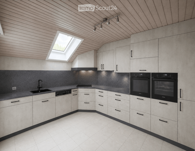 Modern kitchen with white cabinets, dark countertops, and built-in appliances including a dishwasher and oven. Features a skylight window and sleek track lighting.