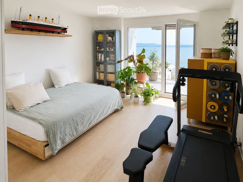 Modern bedroom with a large bed, a treadmill, a small stool, a shelf with books and decorative items, and potted plants near the large window offering a sea view.
