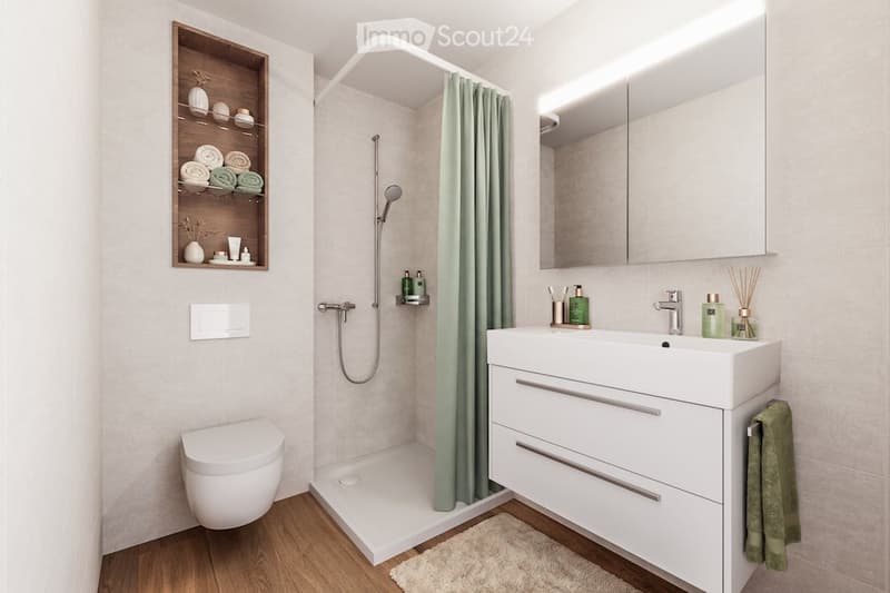 Modern bathroom with a white sink, mirror, toilet, and a shower area with a green curtain. Wooden shelf holds towels and decorative items.