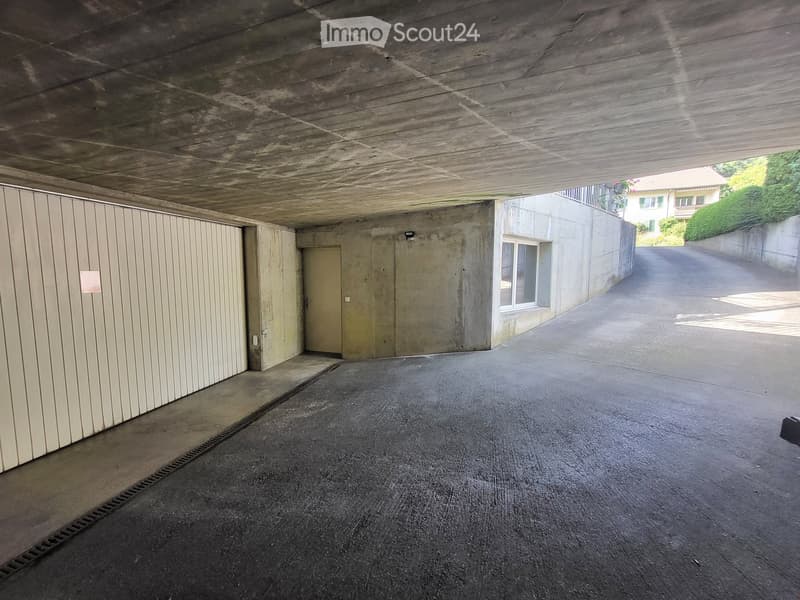 {"type": "Garage", "objects": [], "description": "Underground garage with concrete walls and ceiling, a single garage door, and a small window on the adjacent wall.", "localized_descriptions": {"EN": "Underground garage with concrete walls and ceiling, a