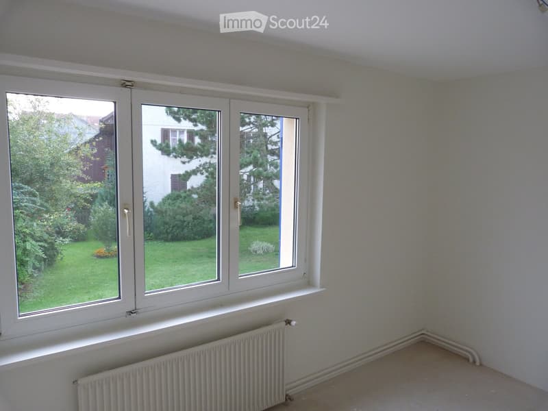white walls, windows, large window with a view, white radiator, empty