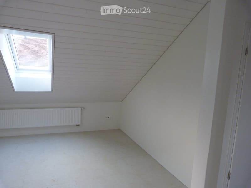 empty room, white walls, white ceiling, white floor, heater, dormer window