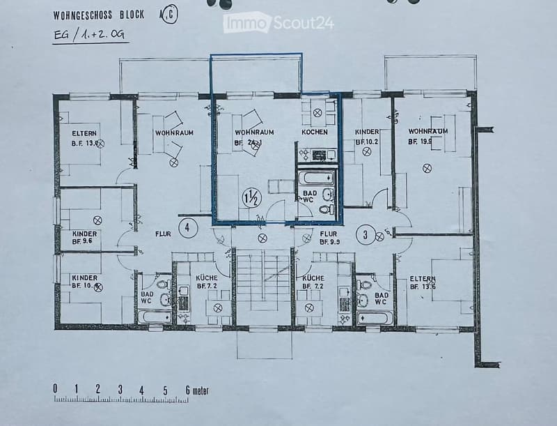 Floor plan of a residential block showing multiple apartments with living rooms, kitchens, bathrooms, and bedrooms.