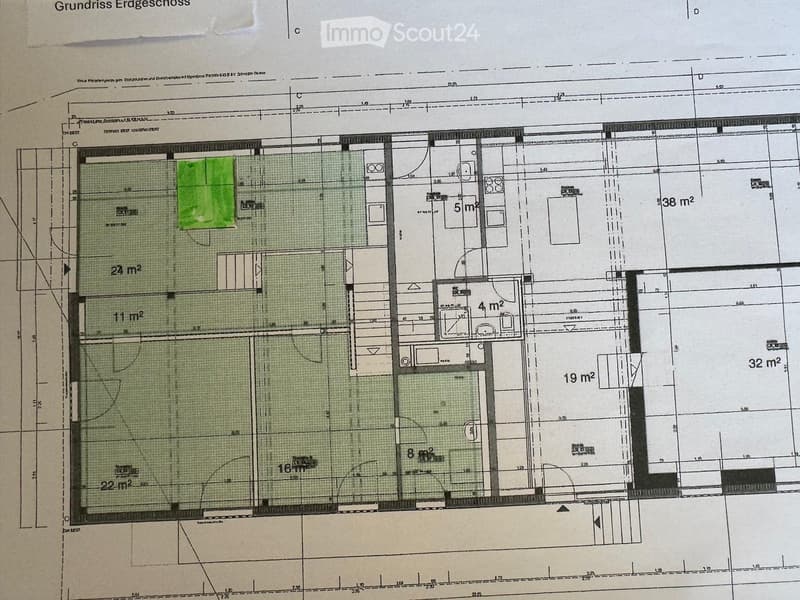 Floor plan of a ground floor showing multiple rooms and areas with labeled dimensions, including a large open space, smaller rooms, and a balcony.