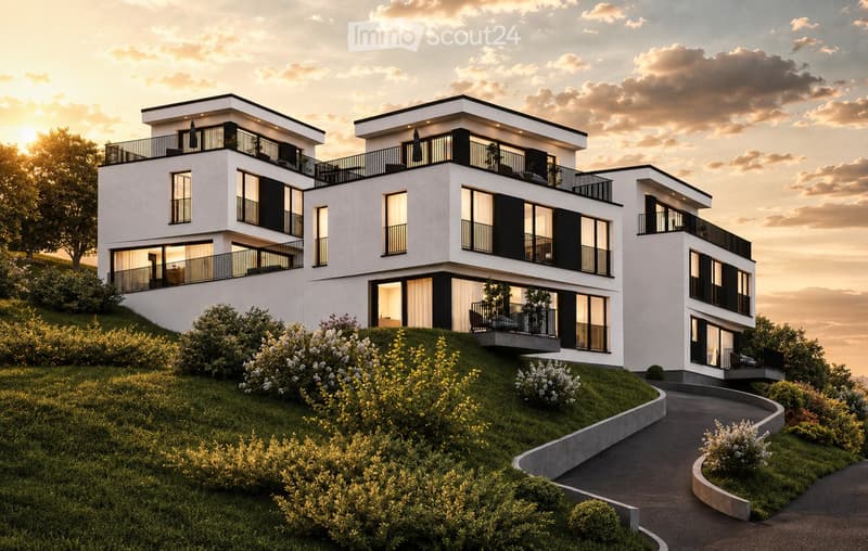 Modern two-story house with white exterior, black accents, multiple balconies, and large windows. The house is situated on a grassy hillside with a curved pathway leading to the entrance.
