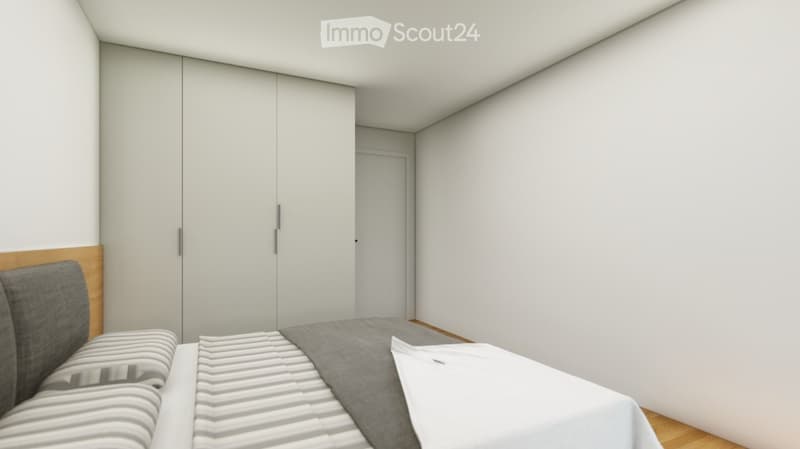 white walls, gray bed, white sheets, gray pillow, two closets, wooden headboard, wooden floor