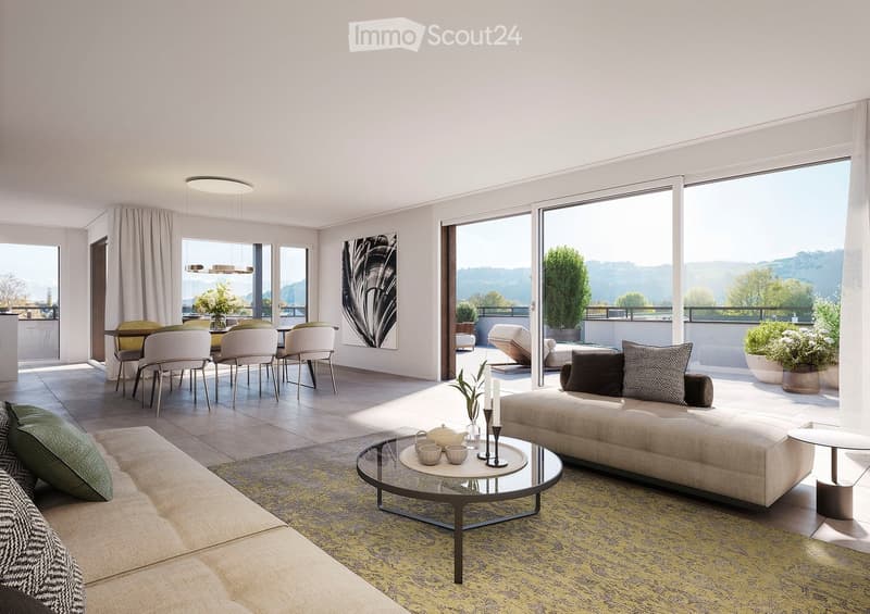 Modern living room with large windows and a view, featuring a beige sofa, glass coffee table, dining area with chairs and table, and decorative items including candles and a picture frame.