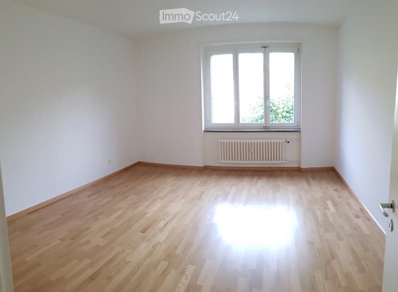 Completely empty room with bare walls and wooden floor. No furniture or equipment.