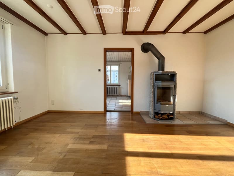 wood floor, white walls, fireplace, large window