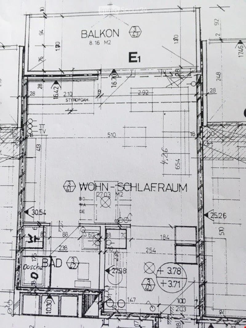 Floor plan of an apartment with a living room, bedroom, bathroom, and balcony.