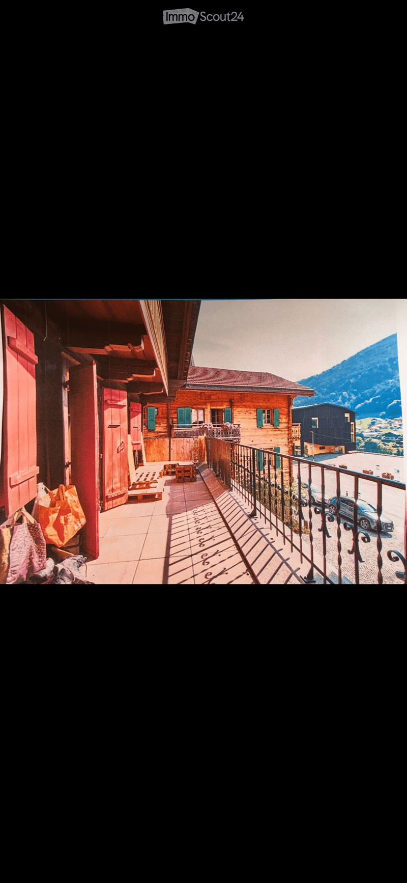 wooden house, red doors, balcony, mountain view