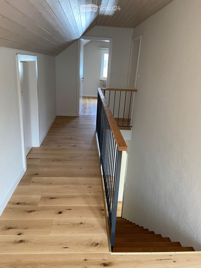 wooden floor, white walls, wooden handrail, wooden stairs