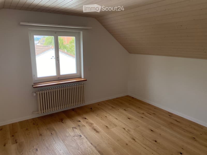 empty room, wooden floor, white walls, window with wooden frame, radiator