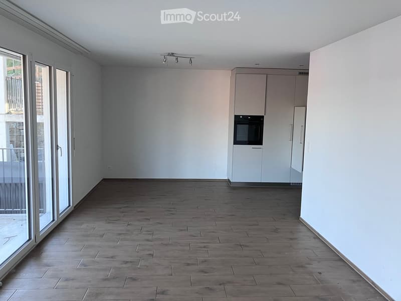 empty room, tiled floor, white walls, sliding glass doors, balcony, built-in appliances