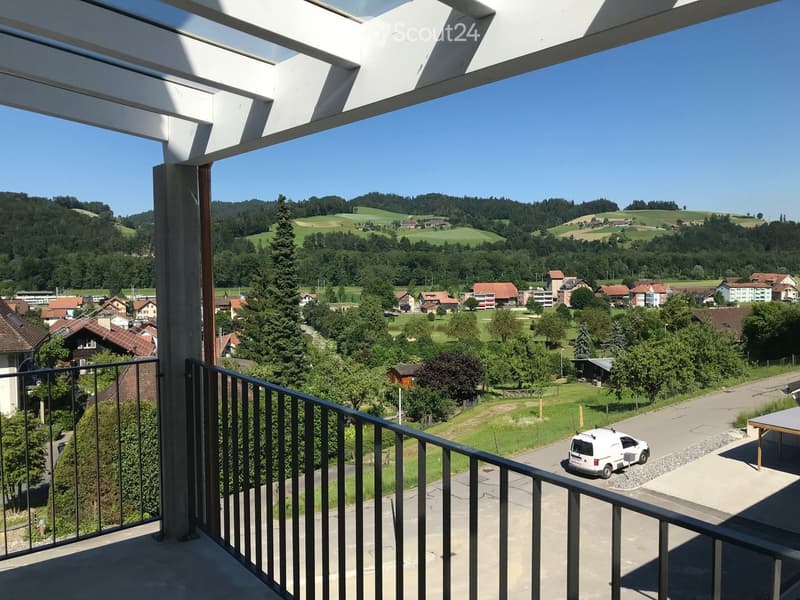 Balcony of a building with view of the landscape and houses