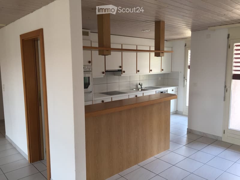 modern kitchen with white tiles, wooden counter, white cabinets, dishwasher, washing machine, gas stove, oven, sink, faucet