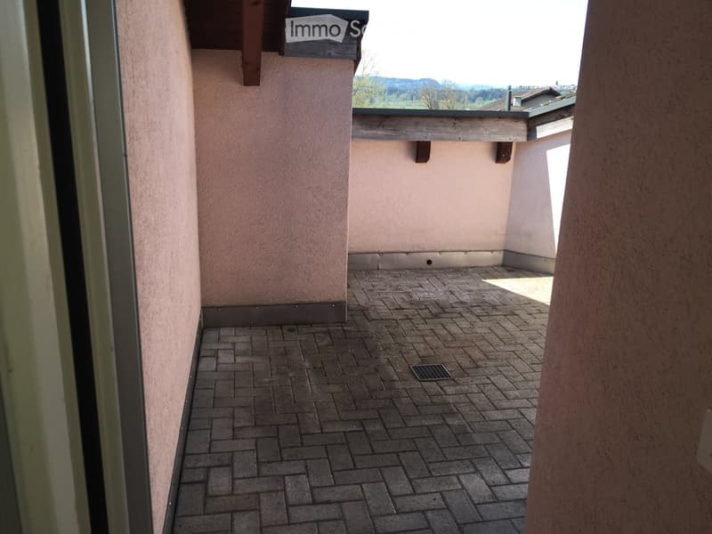brick floor, walls, drain, open to balcony