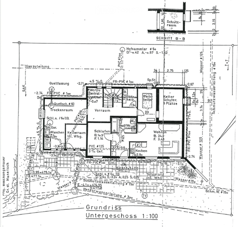 Floor Plan. Floor plan of a basement level showing various rooms including a kitchen, living room, bedroom, bathroom, storage, and utility areas. Includes dimensions, wall placements, and technical details.