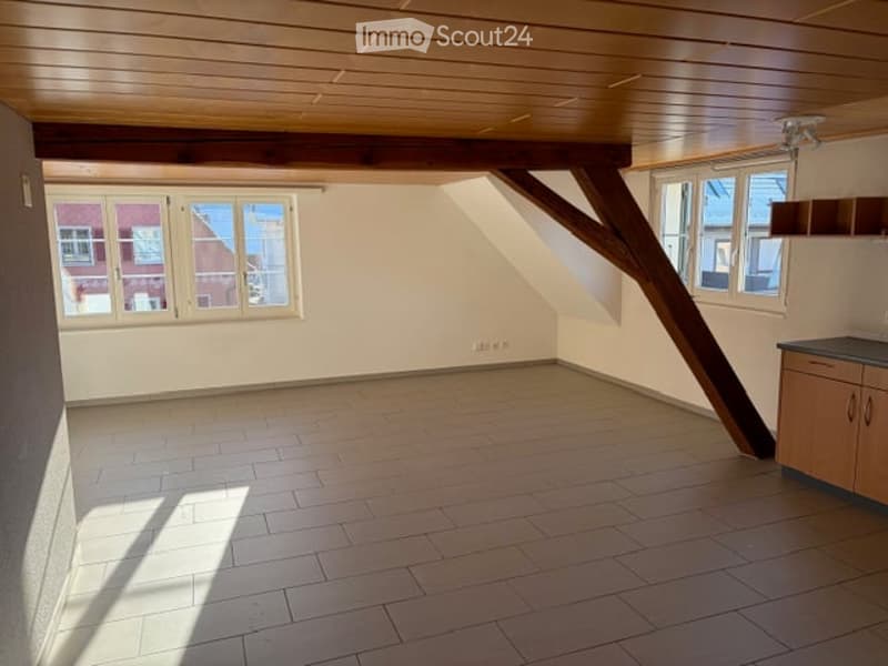 empty room, wooden beams, wooden floor, windows, wall cabinets